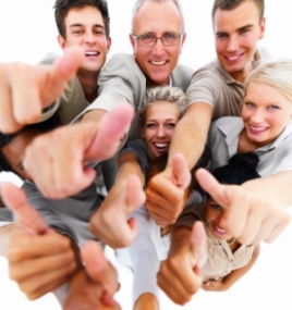 Group of business people giving thumbs up
